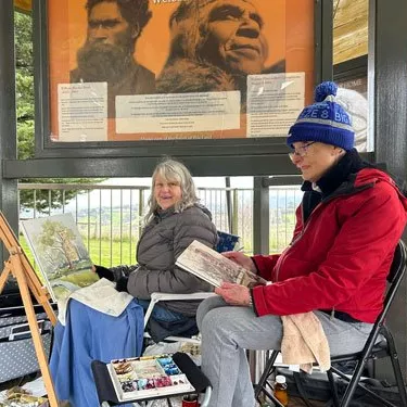 Left: Robyn Lombardi and Suzanne Johnston (VAS) painting at the Eltham War Memorial